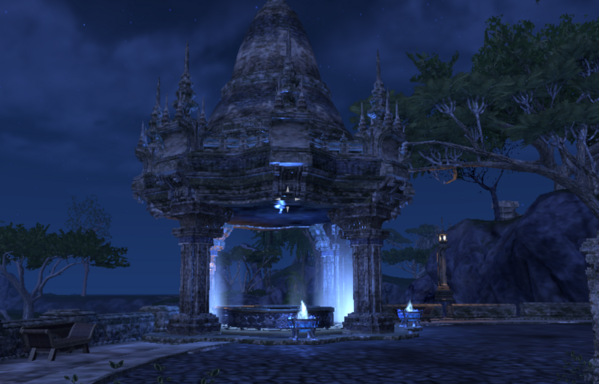 ESO in-game screenshot of the stone pergola on Lucky Cat Landing's terrace at midnight, with a glowing pool and glowing braziers under the pergola projecting their pale blue light upward into the pergola's dome. 