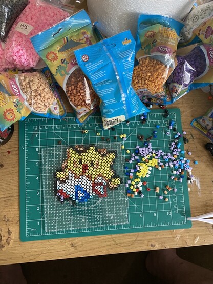 A Togepi from the game Pokémon made from beads, still in progress and the bottom needs finishing 