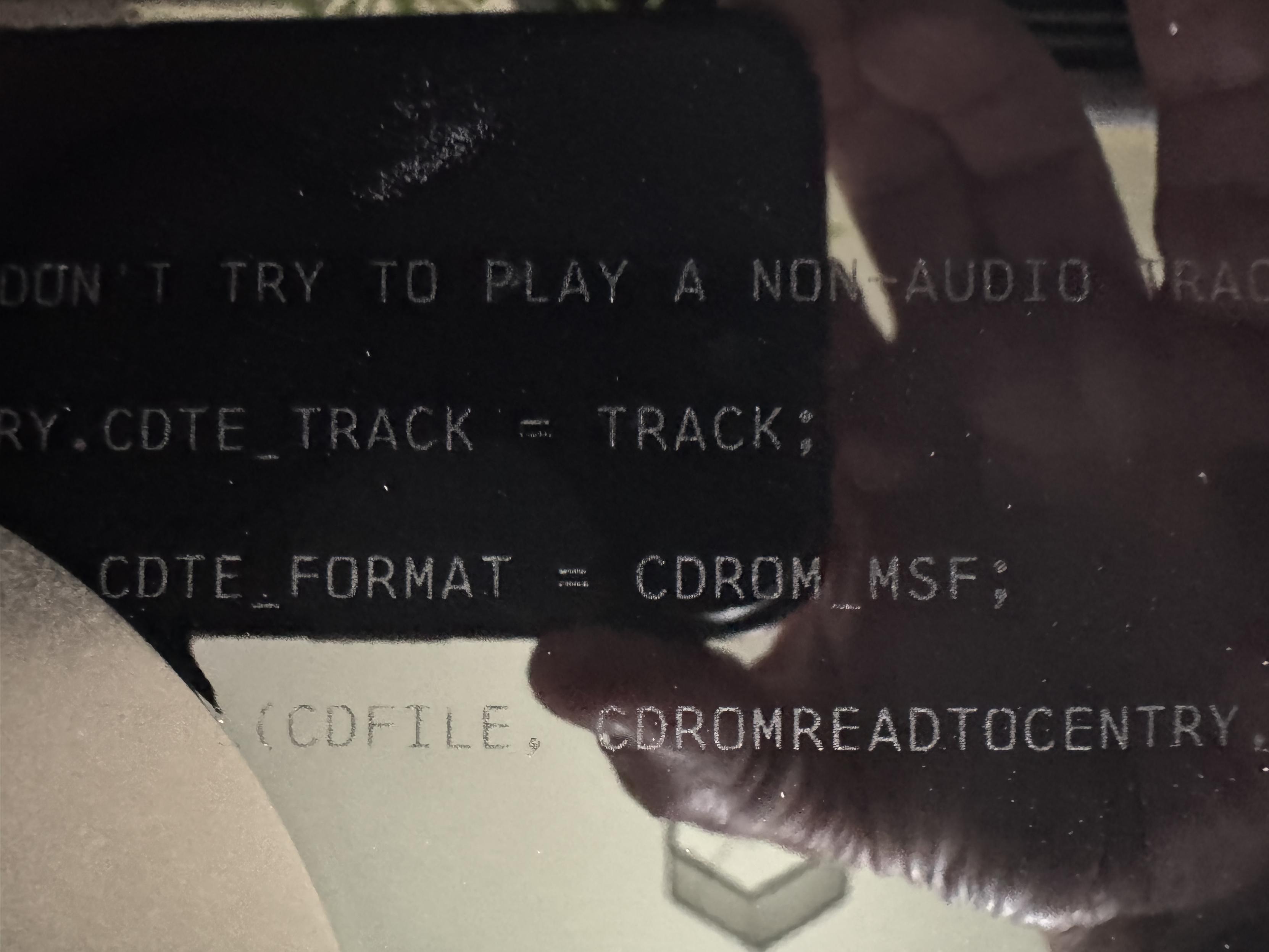 The record is only three sided. The fourth side is etched with a snippet of the C code included on the original PC CD-ROM that made the audio tracks function in a regular CD player. This is a close up of that side of the second record.