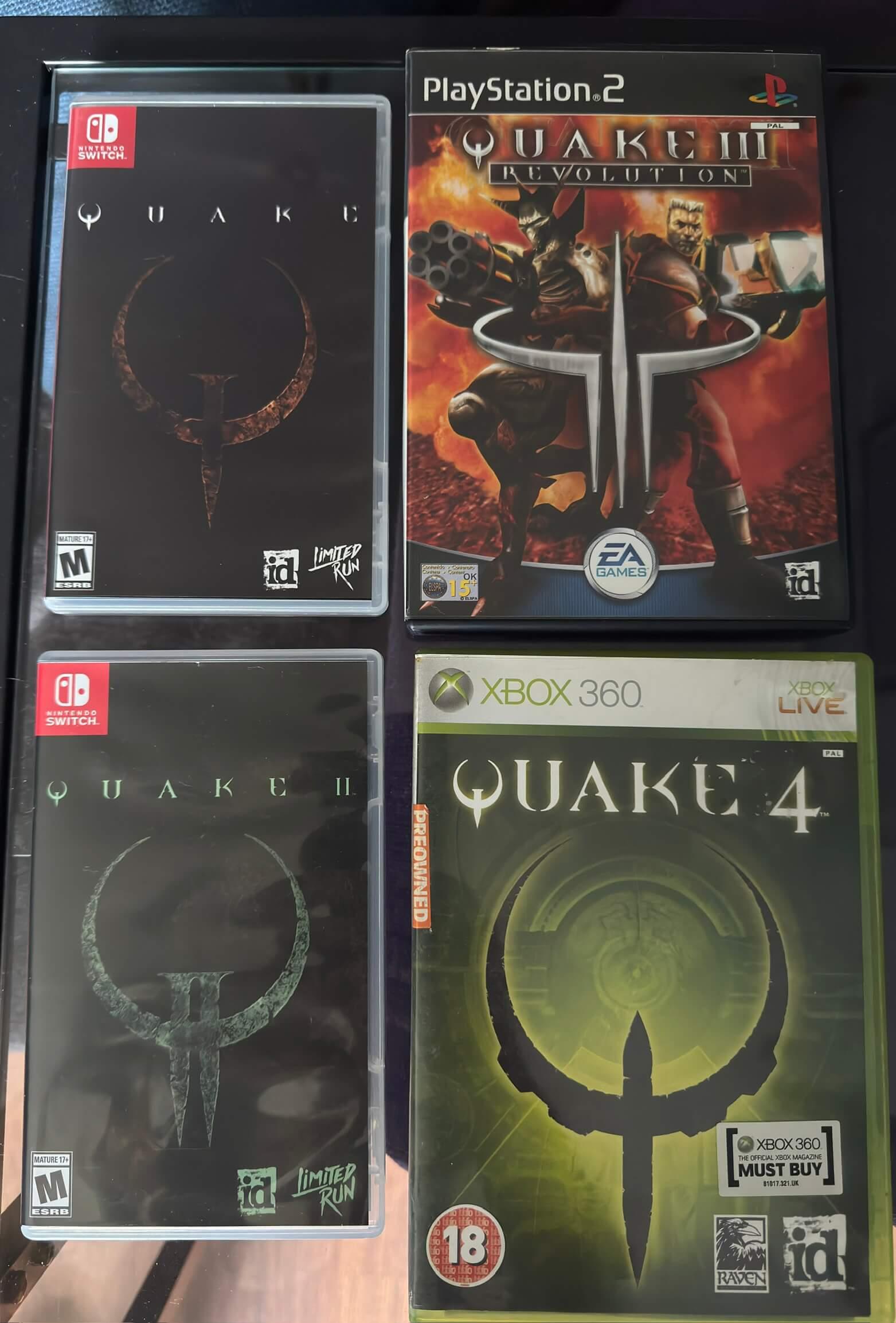 Four videogame boxes in a 2x2 grid with the front covers showing. Starting top-left going anticlockwise: Quake (Nintendo Switch), Quake 2 (Nintendo Switch), Quake 4 (Xbox 360), Quake 3 Revolution (PS2).